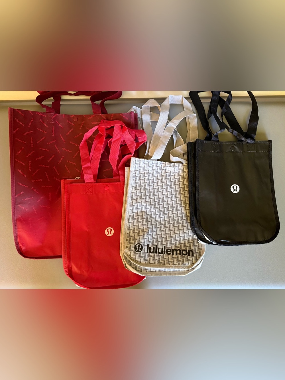 Lululemon 7 Reusable Tote Bags - 1 Large, small 2 Red, 2 Cream, 2 Black